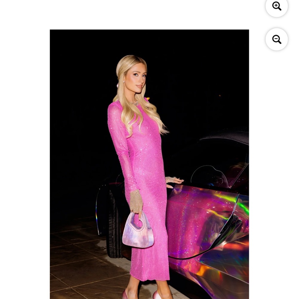 Paris Hilton metallic pink hand with a heart handle and be a crossbody..